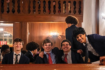 Group of students sitting down at a table. Links to Donor-Advised Funds